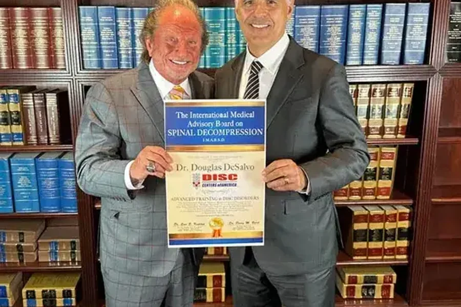 Dr. Douglas DeSalvo receiving board certification in non-surgical spinal decompression