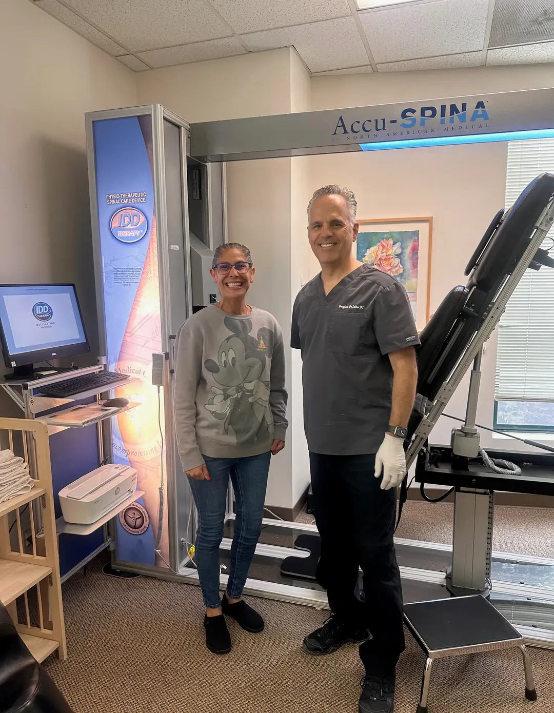 Dr. Douglas DeSalvo with a patient at the Accu-SPINA spinal decompression table at DeSalvo Chiropractic in Novato, CA
