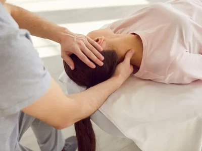 Close-up,Of,Male,Doctor,Physiotherapist,Massaging,Neck,To,A,Young