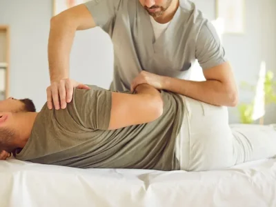 Professional,Male,Chiropractor,Or,Osteopath,Specialist,Works,With,Adult,Man