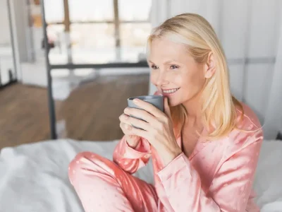 Woman,,Relax,And,Drinking,Tea,On,Bed,For,Wake,Up,
